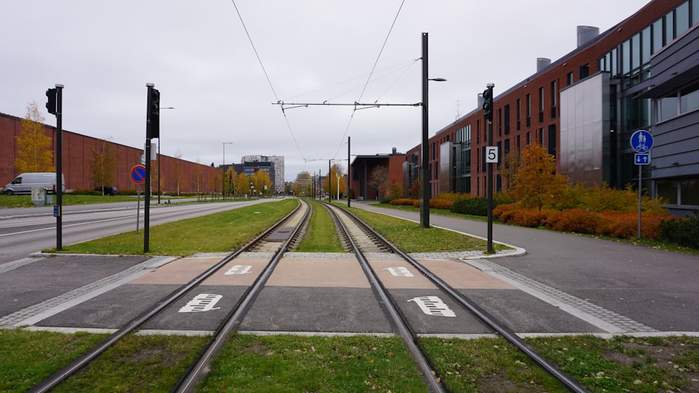 a train track with a building in the background