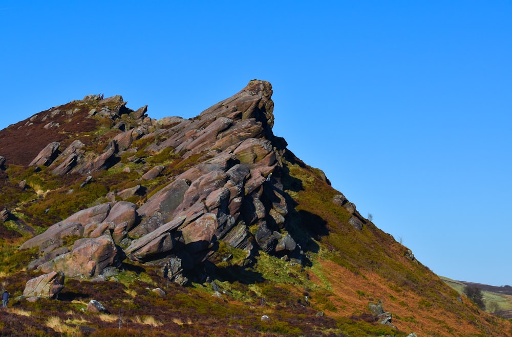 a large rock formation on the side of a mountain