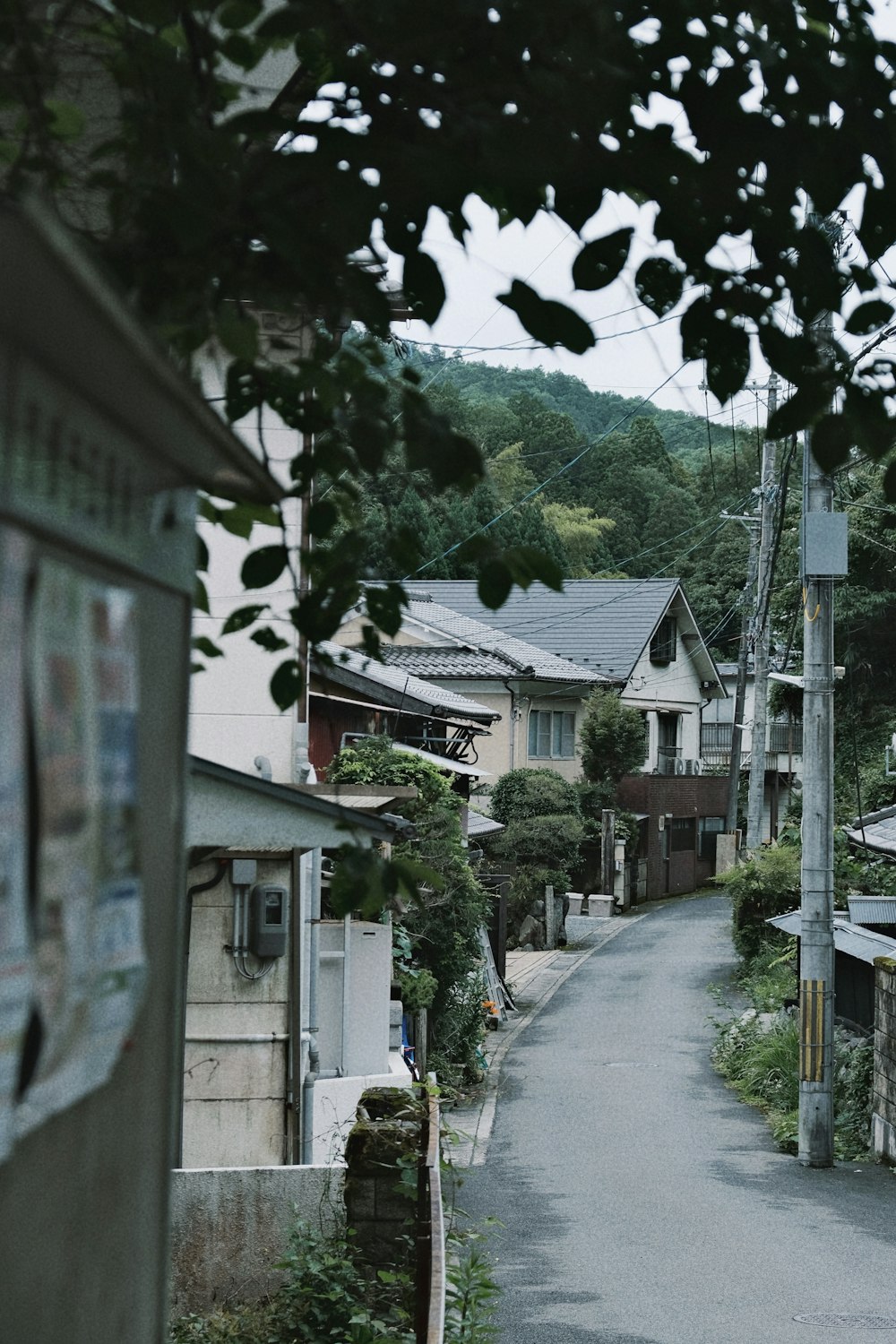 a narrow street with houses on both sides of it