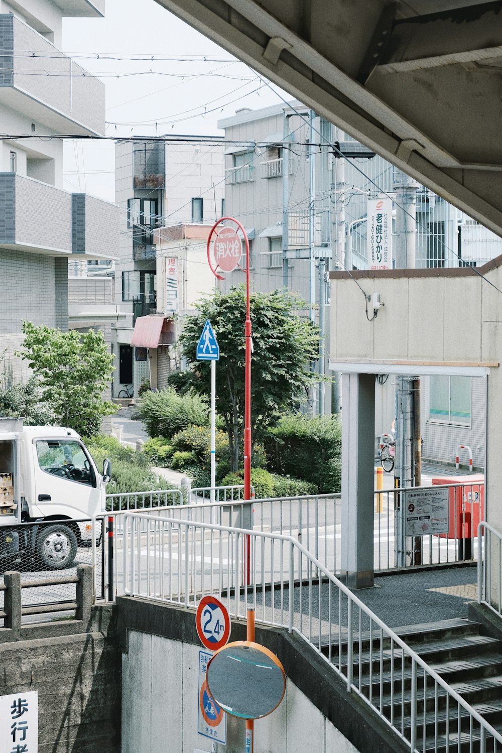 a white truck is parked at a station