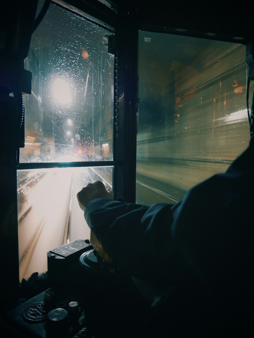 a person sitting in a bus looking out the window