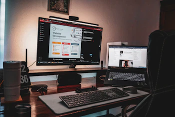 A sleek workspace with a laptop displaying a modern website design, surrounded by AI and digital marketing icons glowing softly.