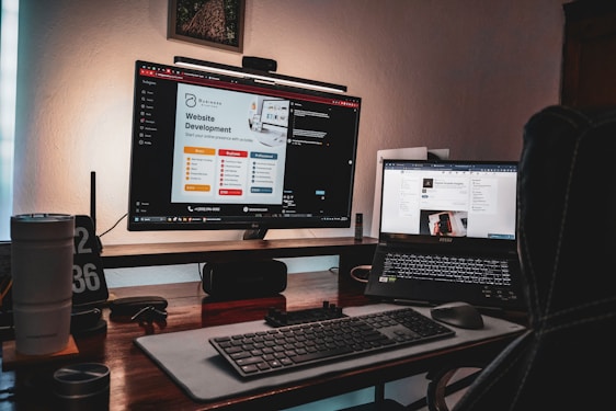 A vibrant workspace with a laptop displaying marketing analytics and digital product icons floating around.