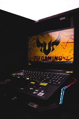 a laptop computer sitting on top of a desk