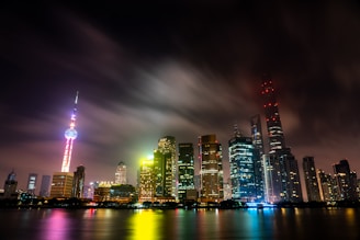 A glowing city skyline illuminated with colorful LED strips at night.
