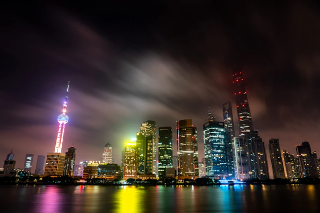 A vivid night city skyline with glowing skyscrapers symbolizing global connectivity and innovation.