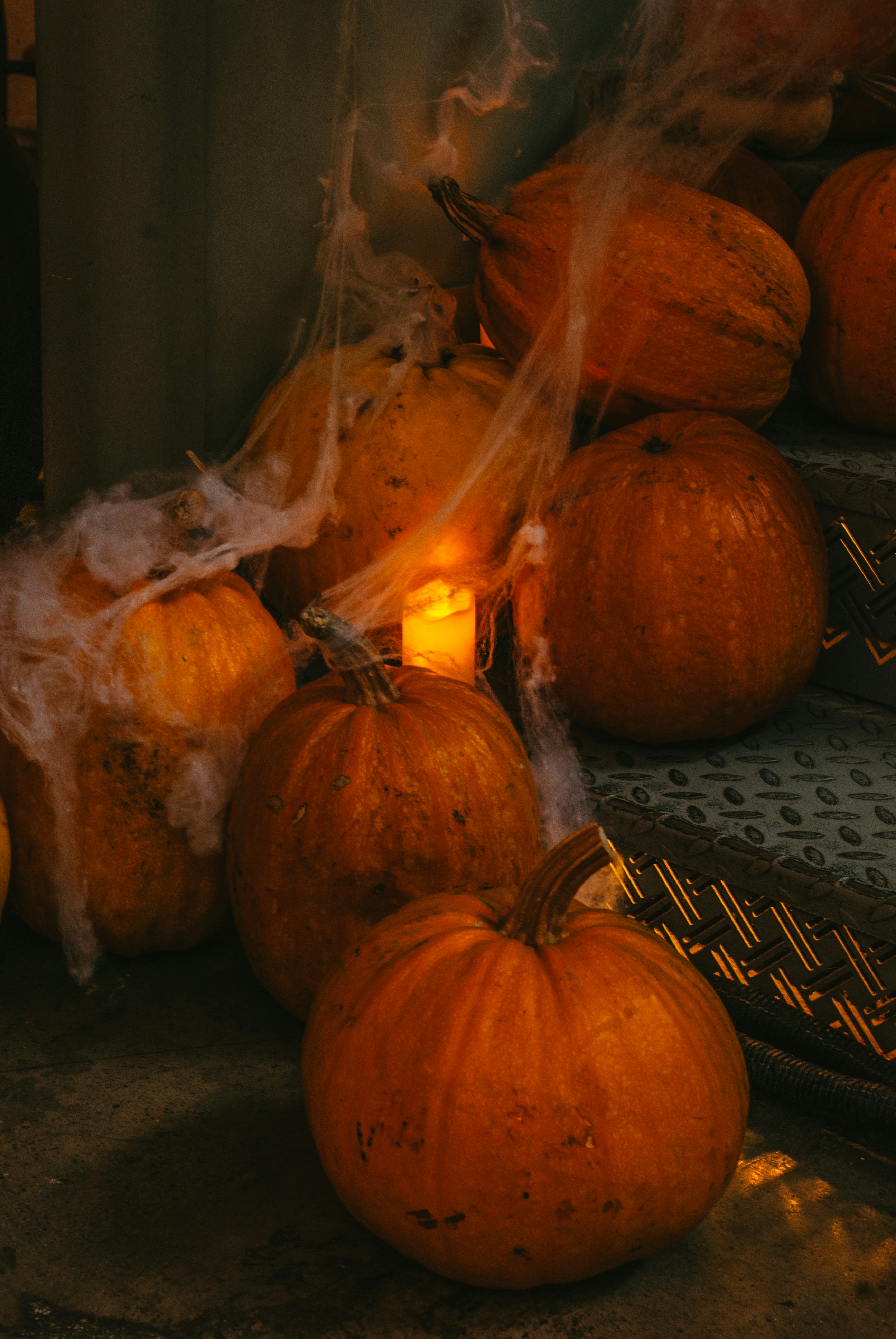 A pile of pumpkins sitting on top of a floor photo – Free Food Image on ...