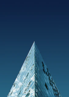 a very tall building with a sky background