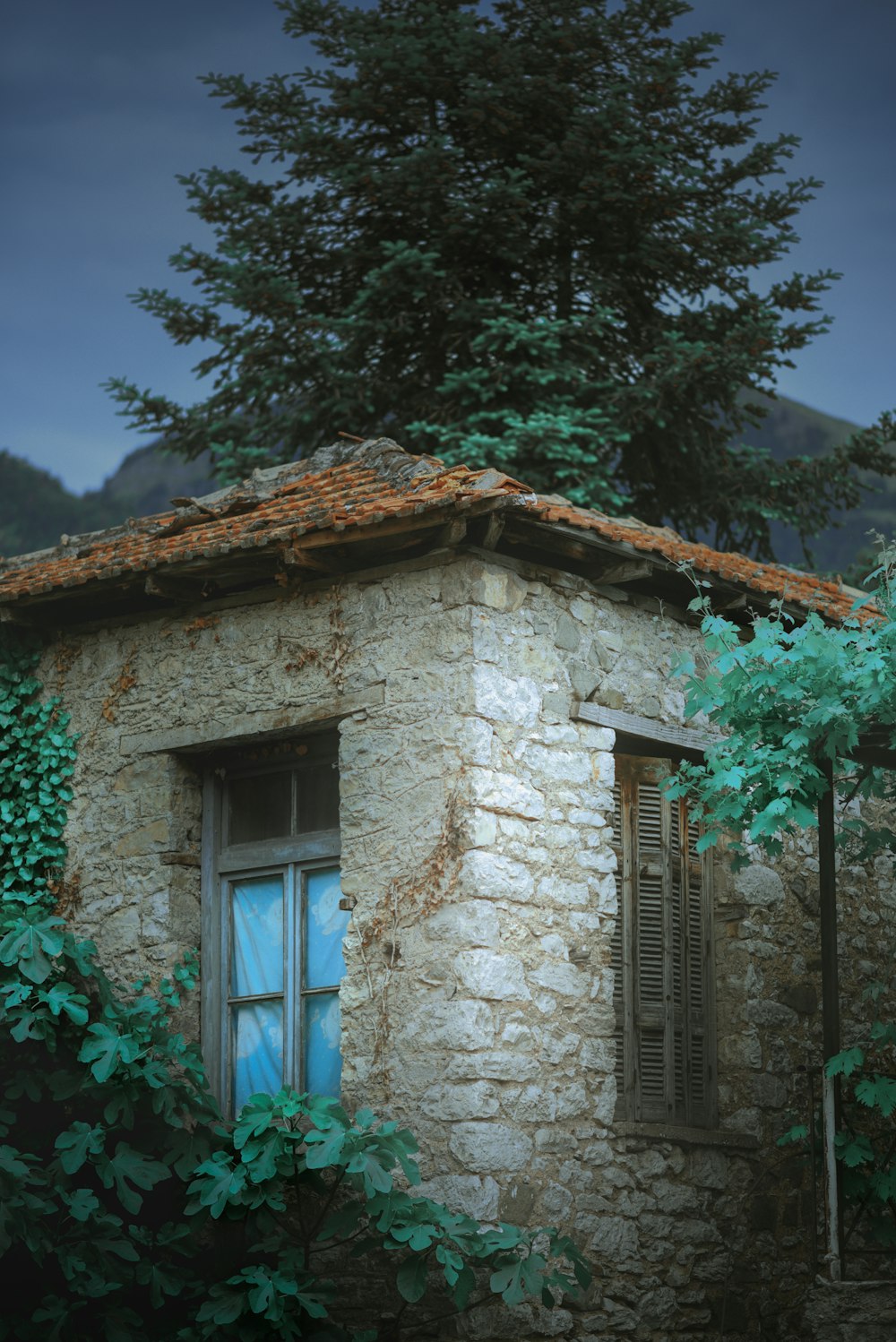 an old stone building with a blue window