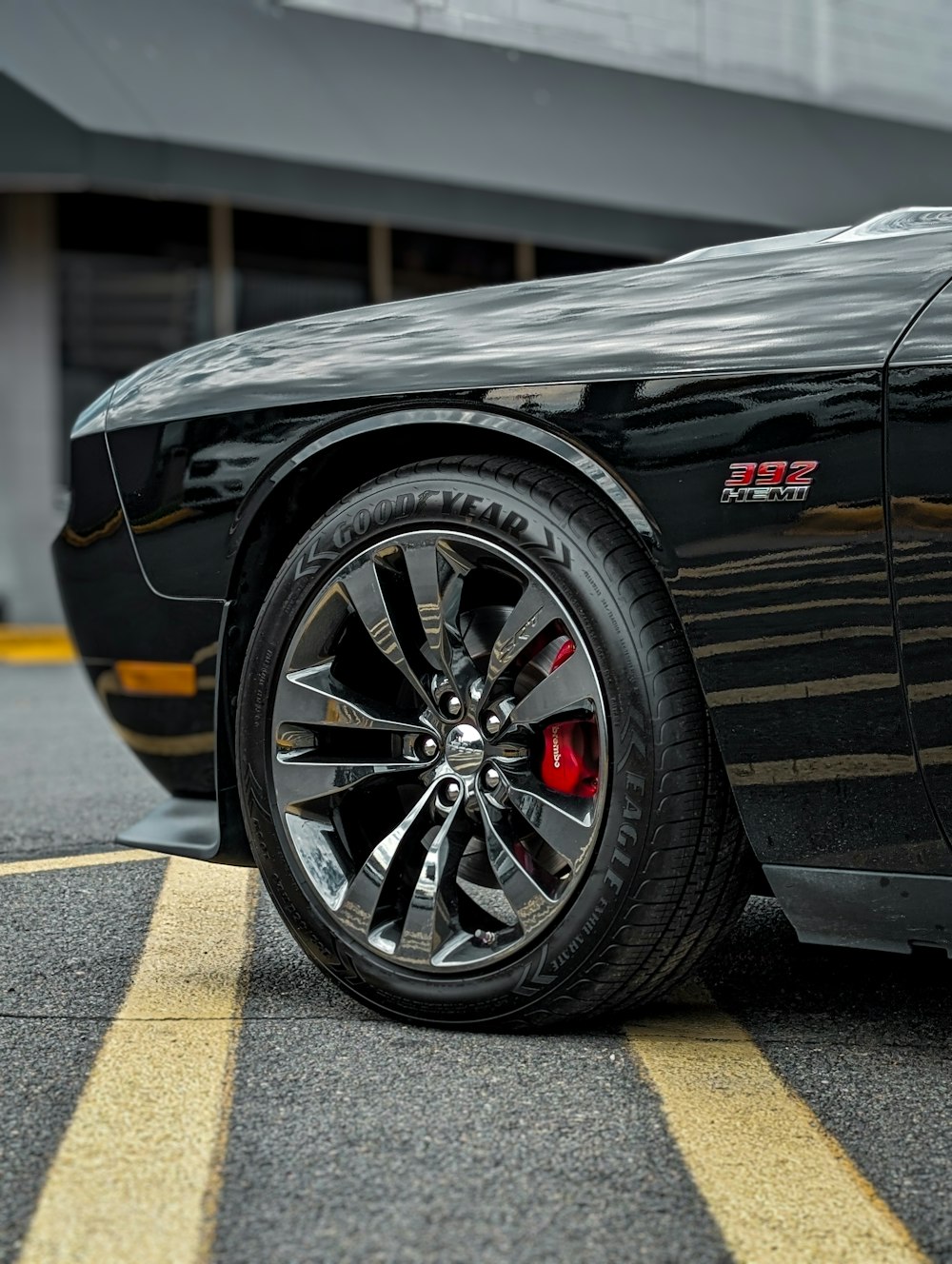 a black sports car parked in a parking lot