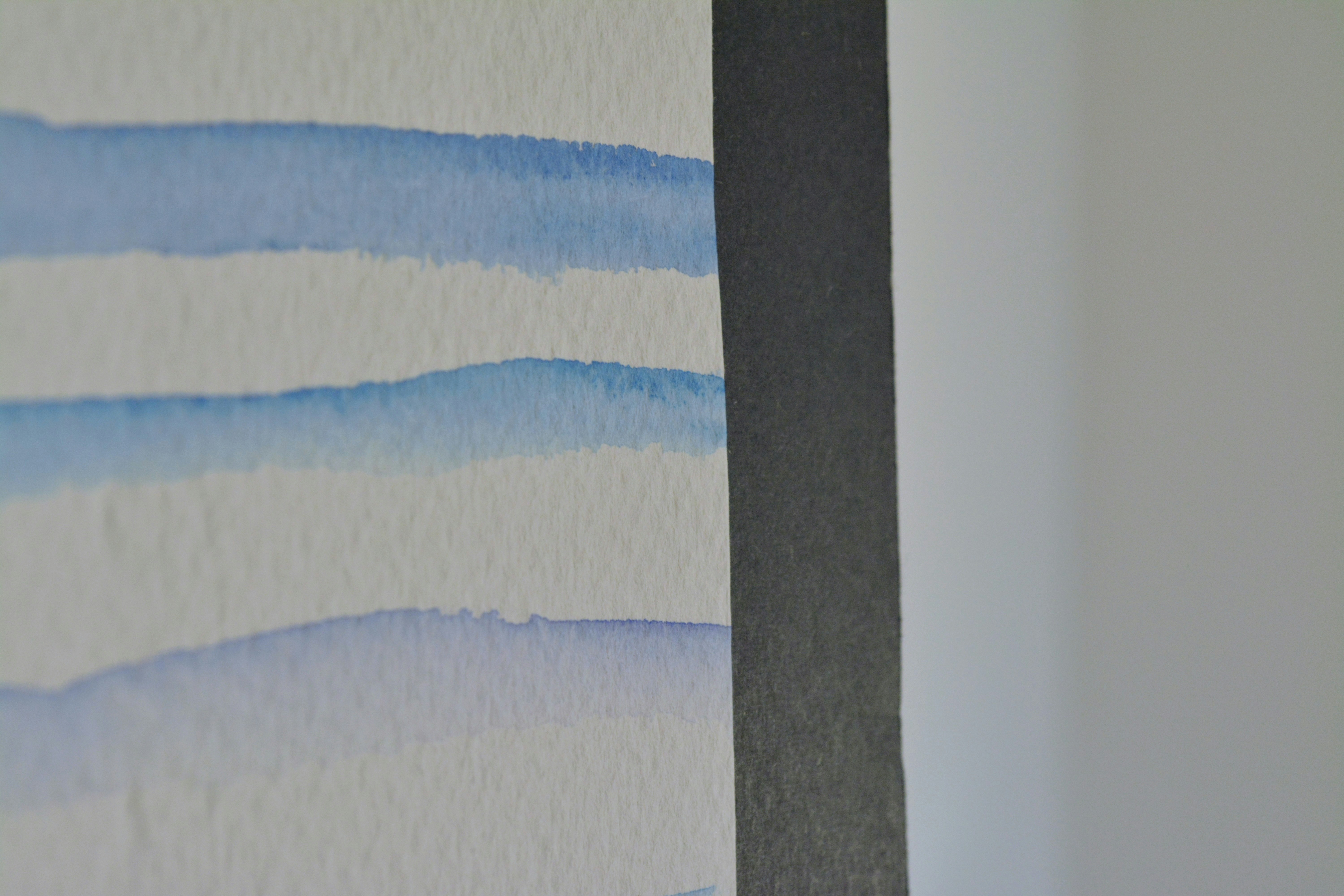 a close up of a wall with a painting on it