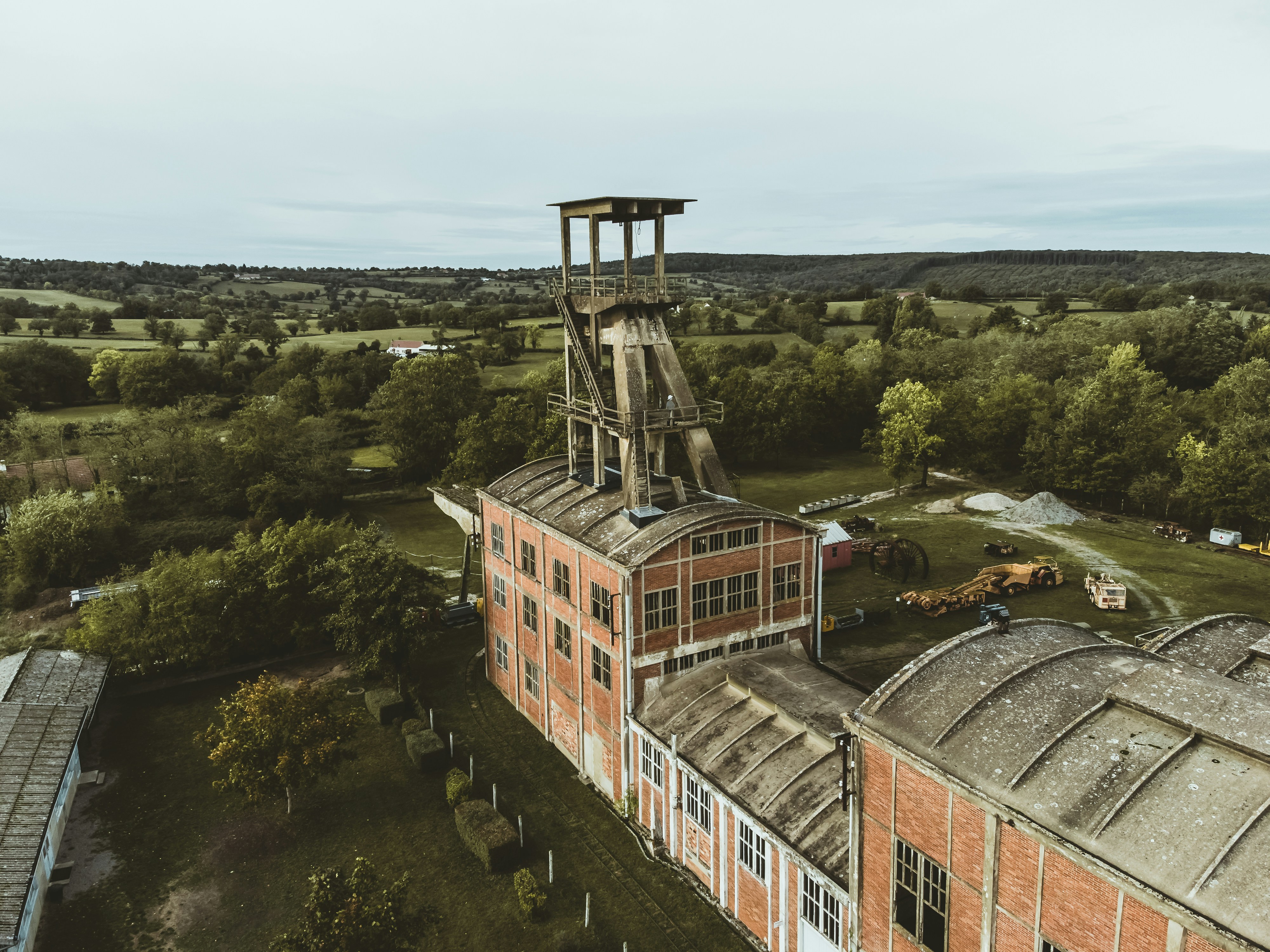 an aerial view of a building with a tower