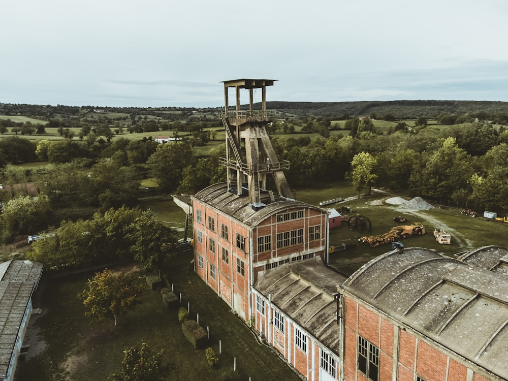 an aerial view of a building with a tower