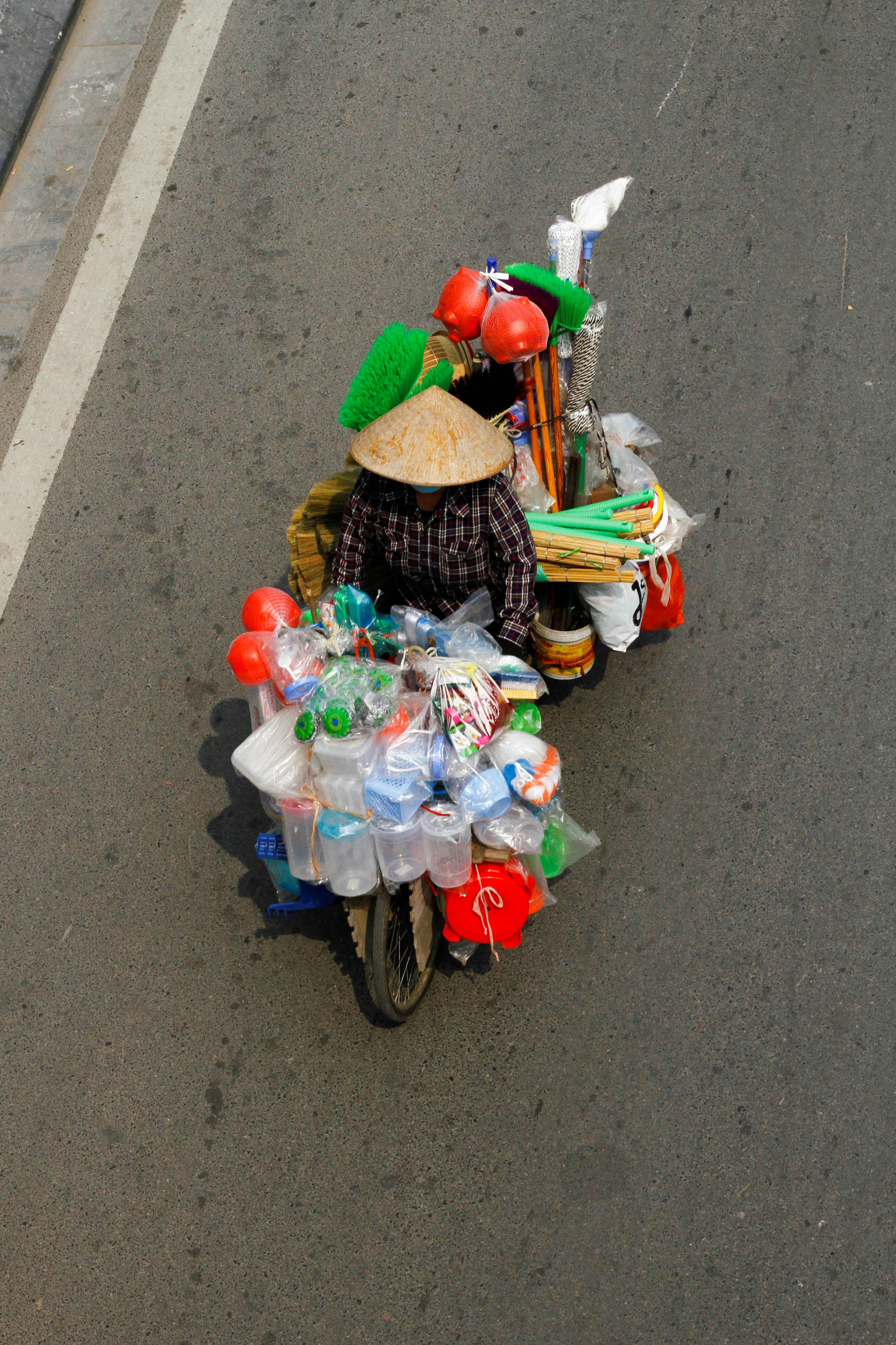 a man riding a motorcycle down a street