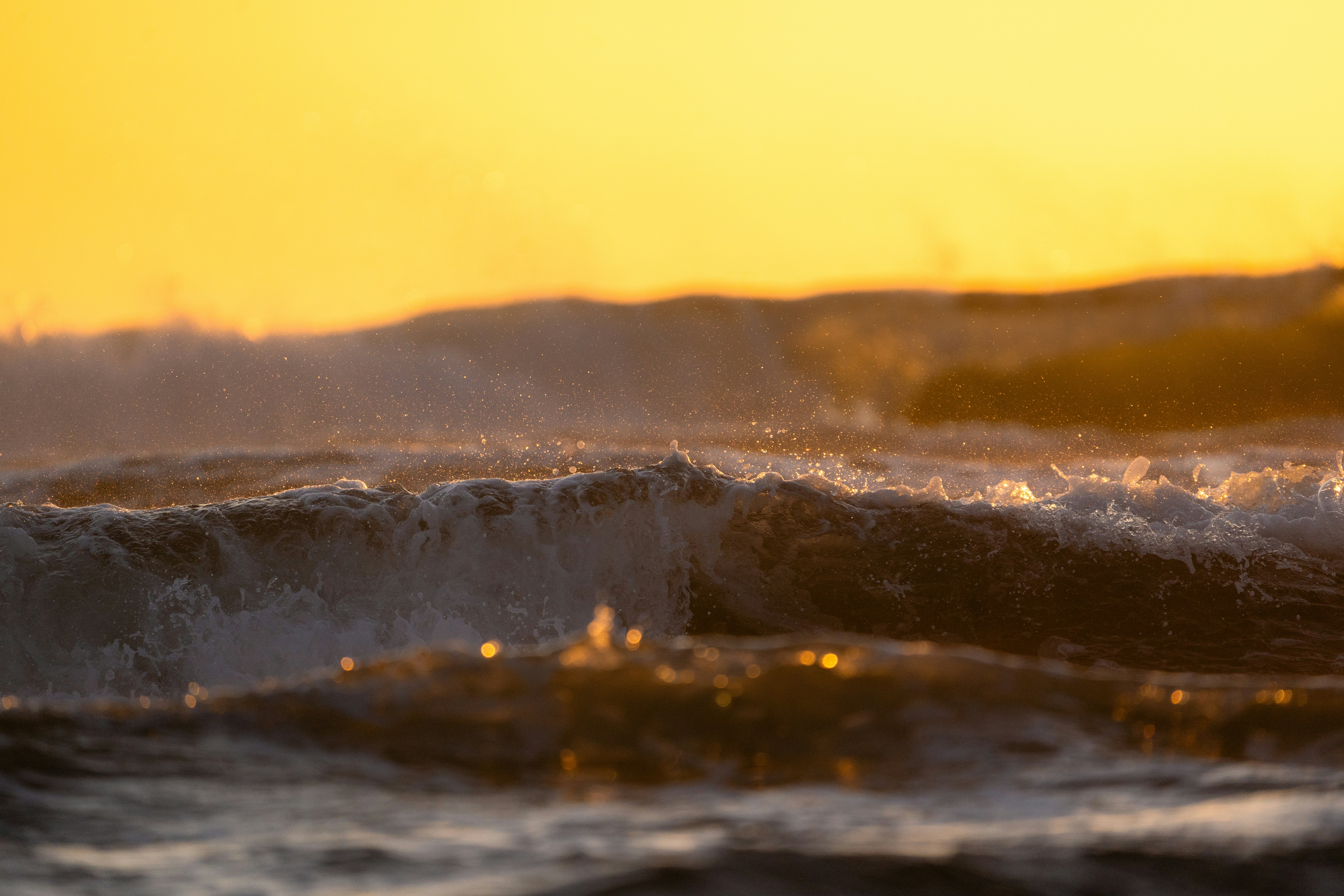 a person riding a surfboard on a wave in the ocean