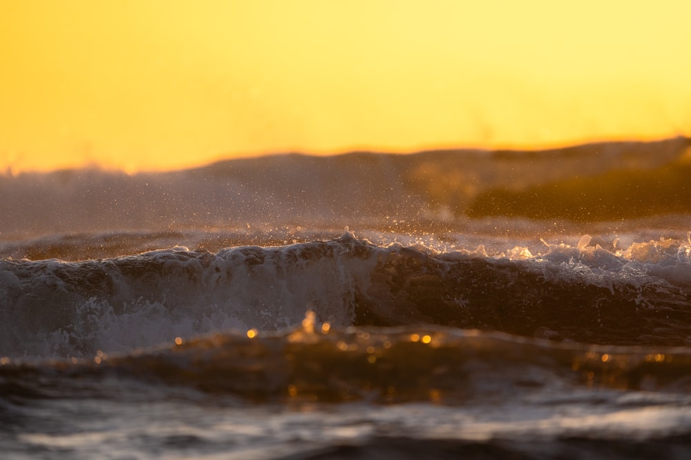 a person riding a surfboard on a wave in the ocean