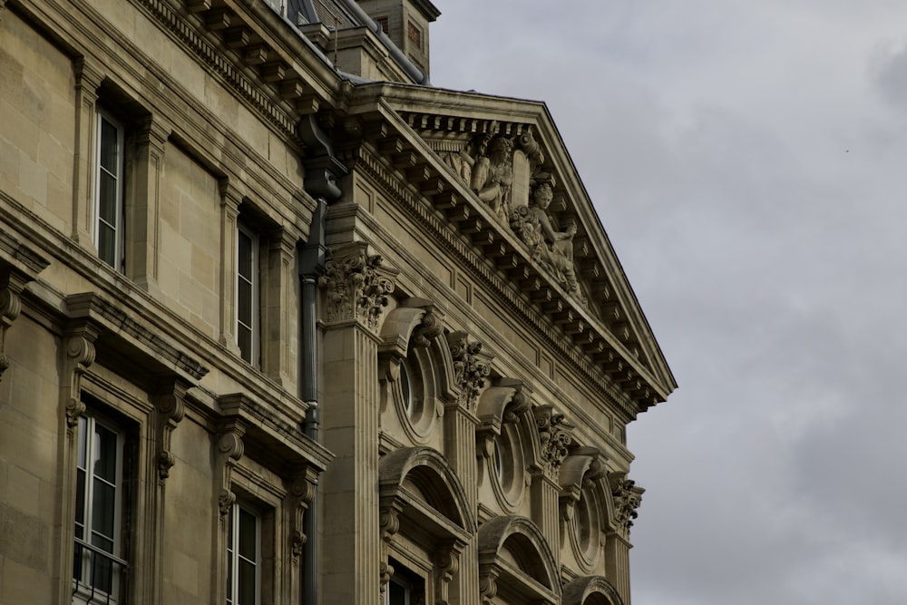 a tall building with a clock on the top of it