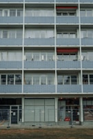 Wide shot of residential building balconies secured with inox 304l nets.