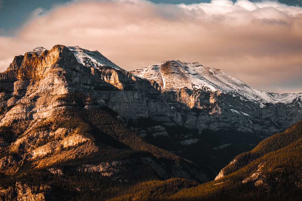 a view of a mountain range with snow on the top