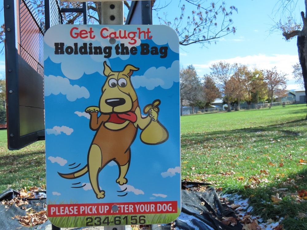 a sign with a cartoon dog holding a bag