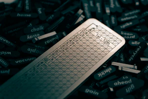 A sleek laptop screen displaying scramblio’s word unscrambler interface with colorful word results.