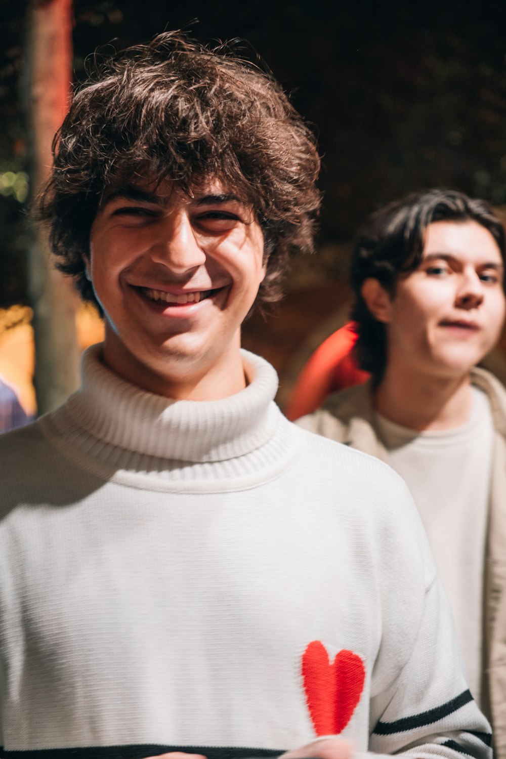 a man with a heart on his sweater