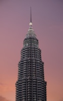 a very tall building with a clock on the top