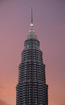 a very tall building with a clock on the top