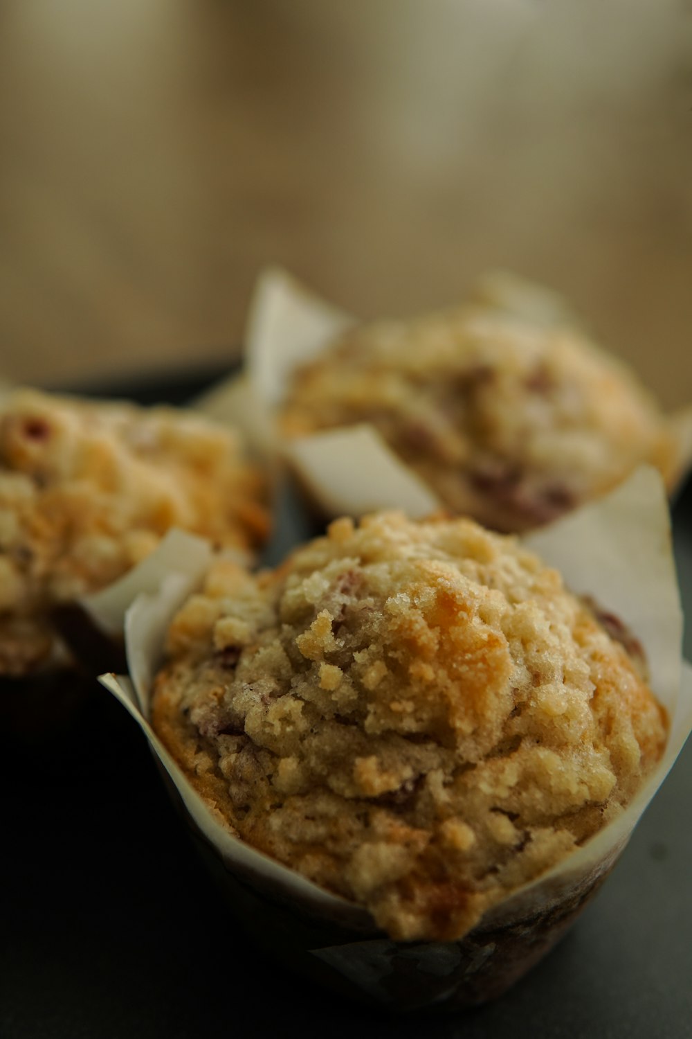 a muffin sitting on top of a black plate