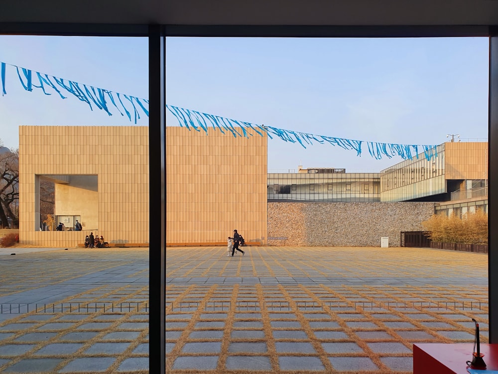 a person walking in front of a building