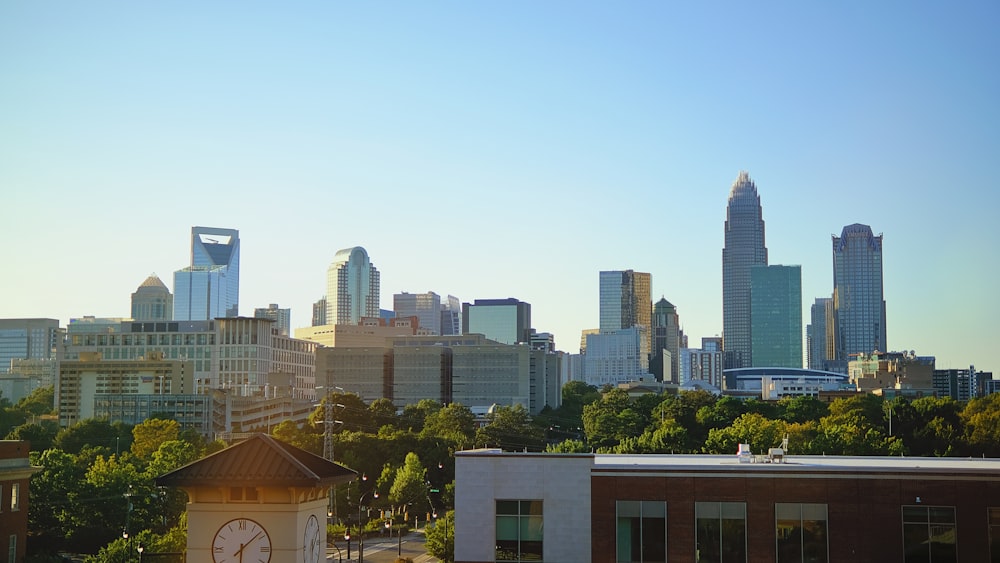 a city skyline with a clock tower in the foreground