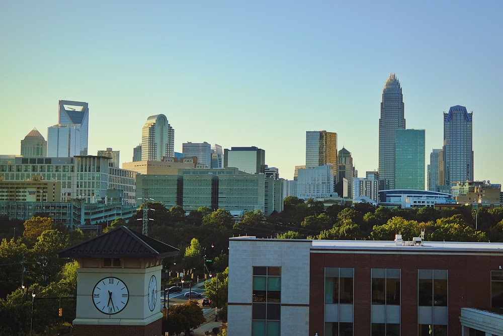 a city skyline with a clock tower in the foreground