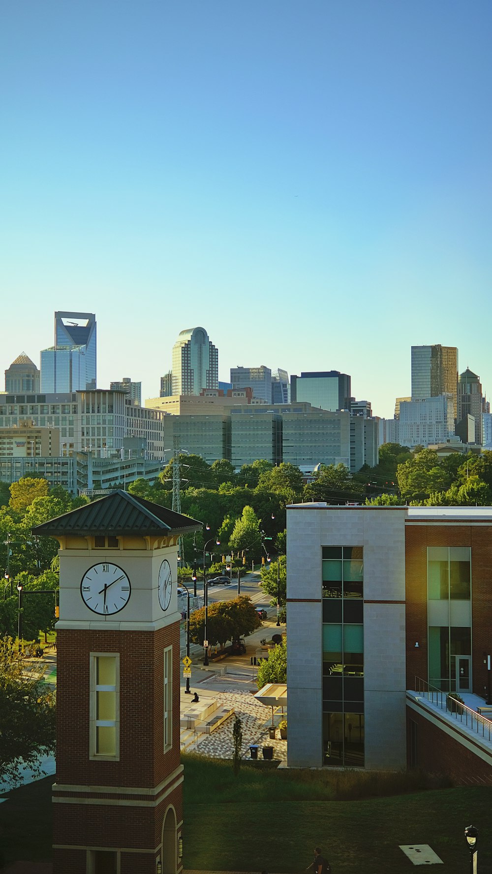 a city skyline with a clock tower in the foreground