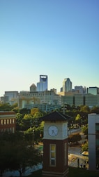 a city skyline with a clock tower in the foreground