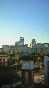 a city skyline with a clock tower in the foreground