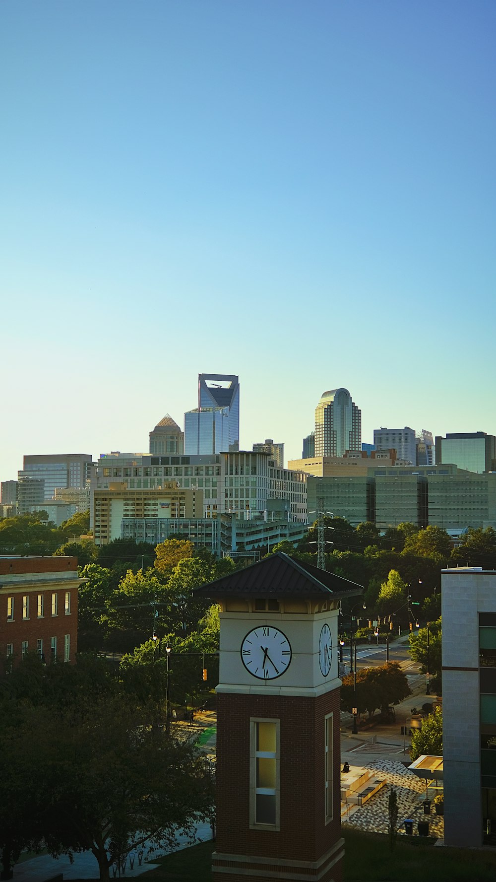 a city skyline with a clock tower in the foreground