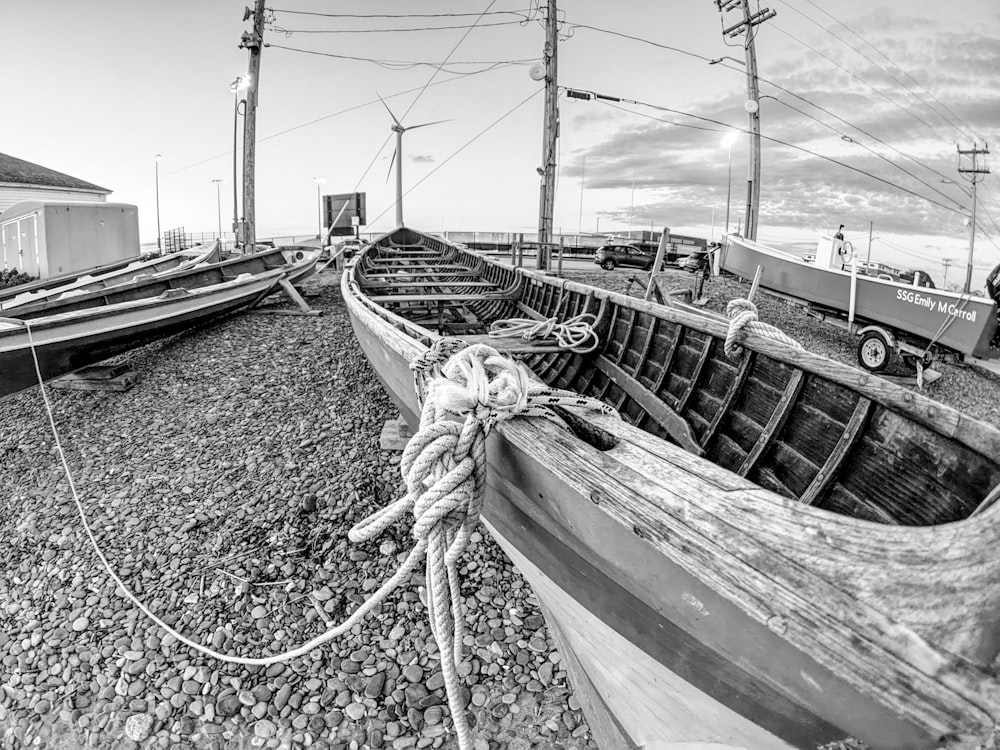 a black and white photo of a boat on the beach