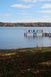 Relaxing dock on an Ontario waterfront property, showing cottage enjoyment and maintenance expenses.