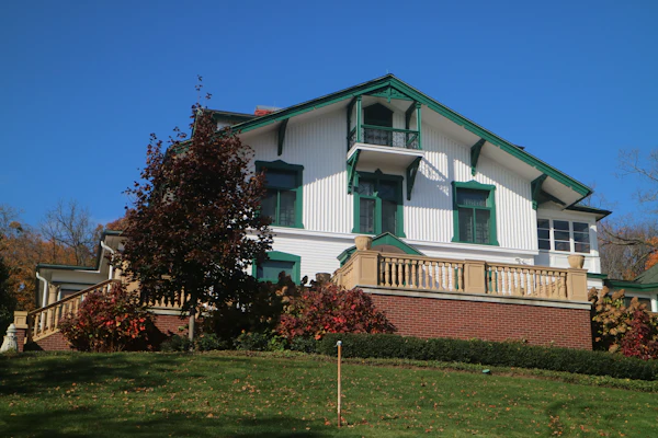 Classic white New England colonial home in autumn