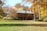 A beautifully landscaped yard with vibrant fall colors.