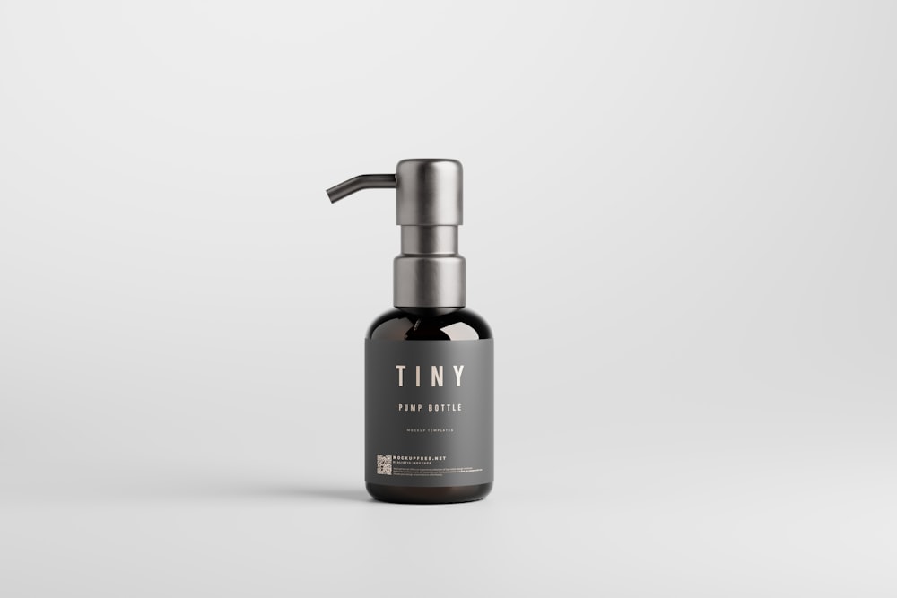 a bottle of tiny hair products on a white background