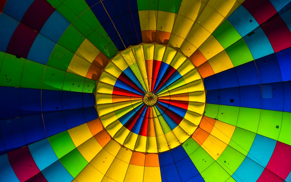 the inside of a colorful hot air balloon