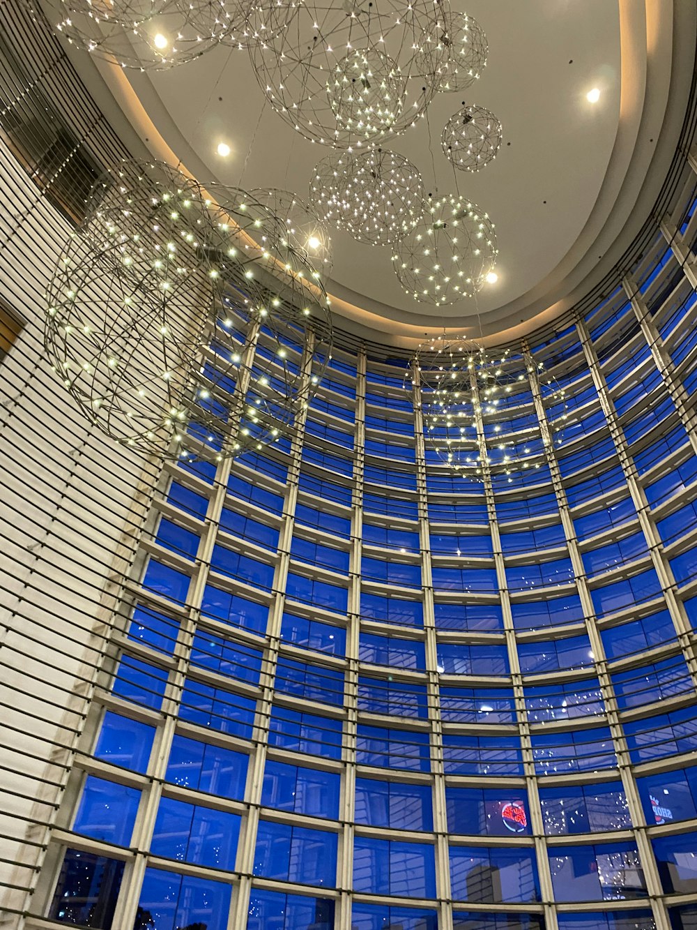 a circular room with a chandelier hanging from the ceiling