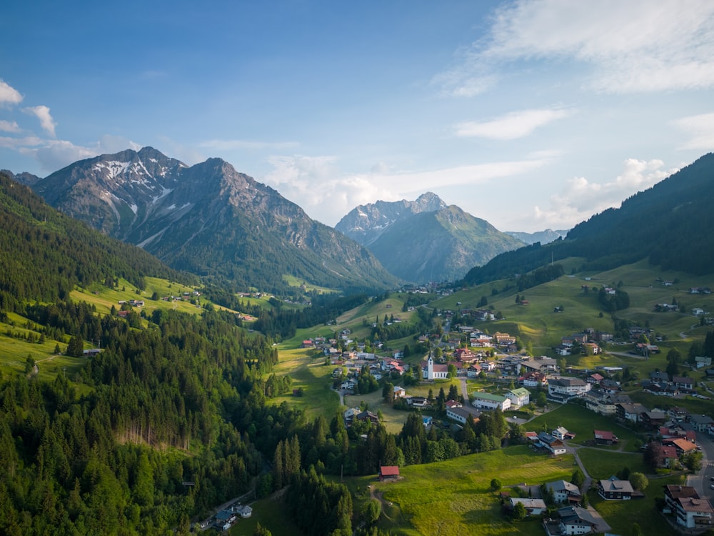 a small village nestled in a valley surrounded by mountains