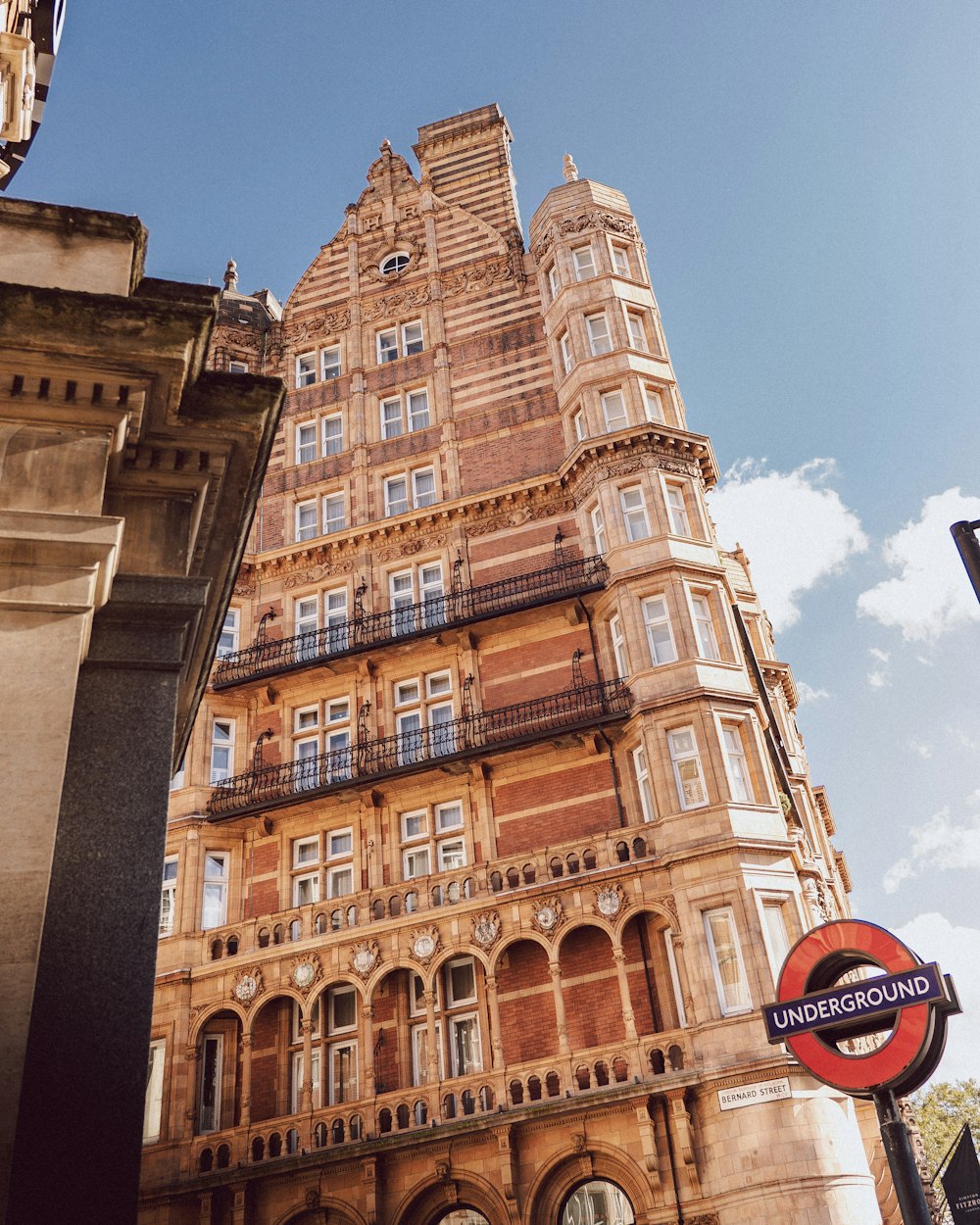 a tall building with many windows and balconies