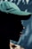 a man wearing a green hat and a black shirt