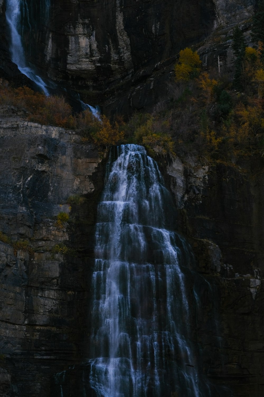 a tall waterfall with lots of water coming out of it