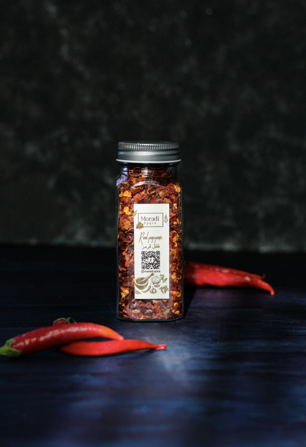 a jar of chili seasoning sitting on a table