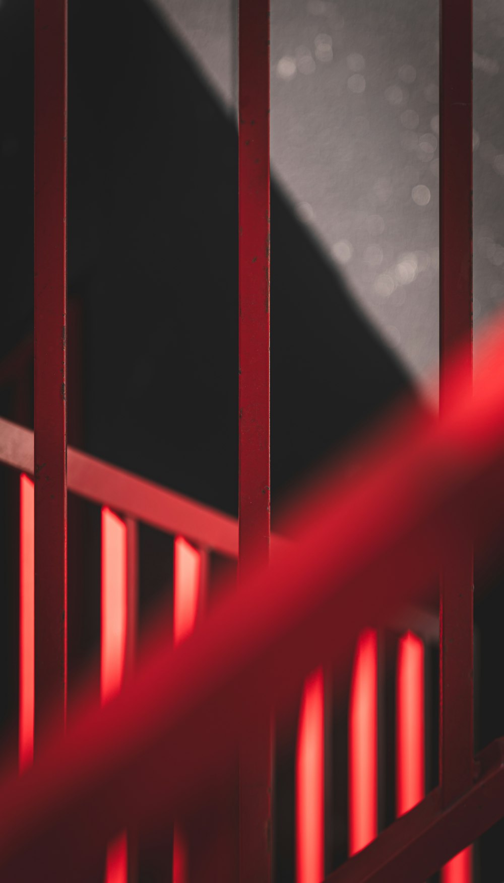 a close up of a red metal fence