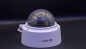 A close-up of a high-definition surveillance camera outdoors.
